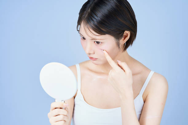istock Young woman checking her skin condition 2196830152