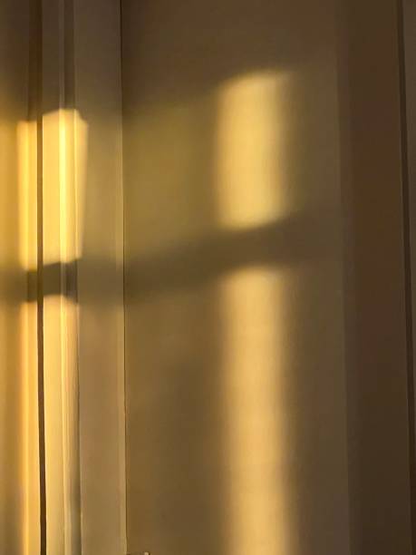 istock Shadow of a curtain on a wall 2196831299