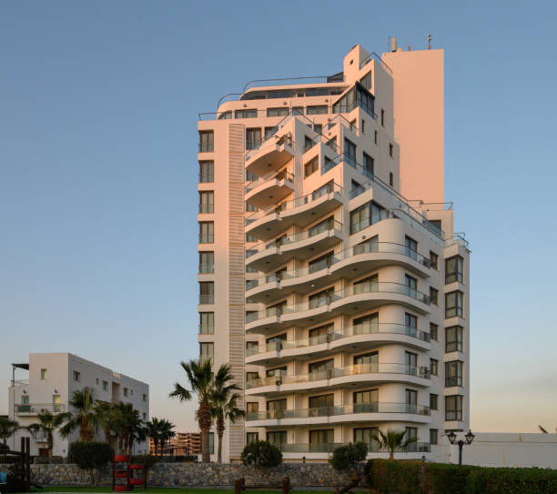 istock Modern architectural marvel shines under the warm sunset in a coastal city 2196833881