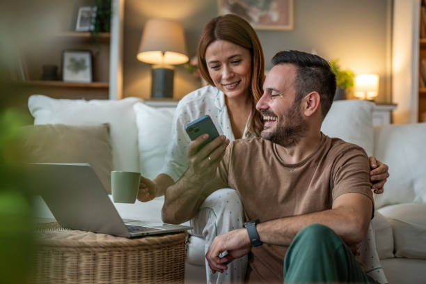 istock From texts to TikToks, a couple immersed in their phone on the sofa 2196835711
