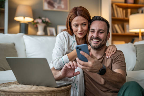 istock From texts to TikToks, a couple immersed in their phone on the sofa 2196835730