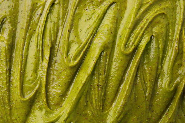 istock Tasty pistachio cream as background, top view 2196837079