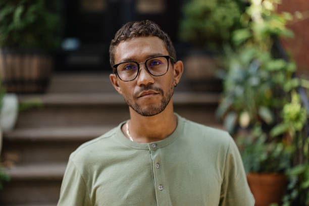 istock Thoughtful Man with Glasses Outdoors in a Serene Urban Setting 2196837790