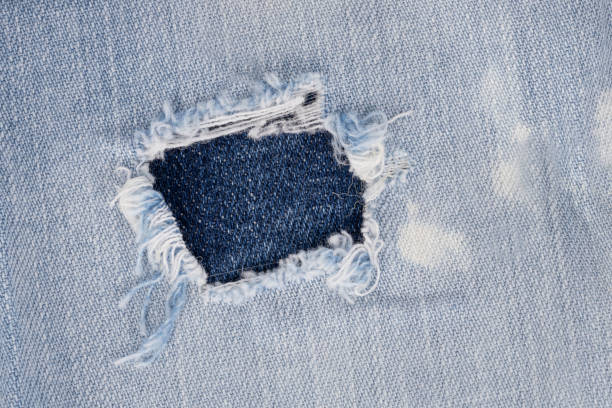 Close Up of Ripped Blue Denim Fabric