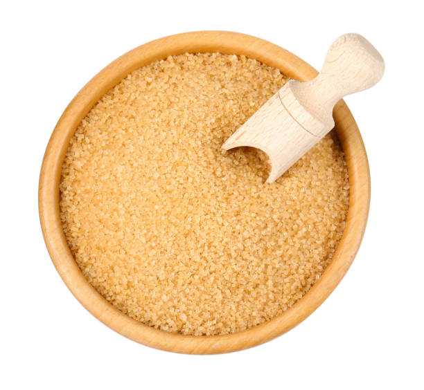 istock Brown sugar in bowl and scoop isolated on white, top view 2196837958