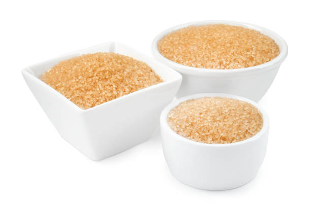istock Brown sugar in bowls isolated on white 2196837987