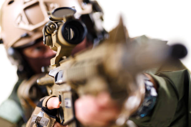 istock Focused tactical soldier aiming rifle with precision in combat gear 2196839562