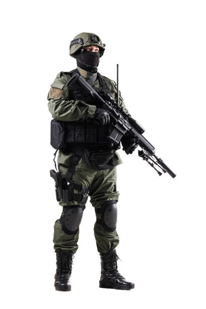 Security personnel in tactical uniform holding a firearm on white background