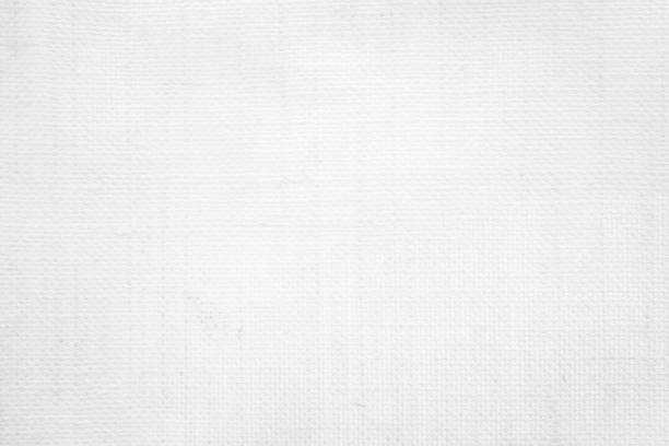 istock White color fabric canvas woven texture background in pattern light blank. Natural gauze linen, carpet wool and cotton cloth textile textured as clean empty for decoration text. Grey sack material. 2196840610