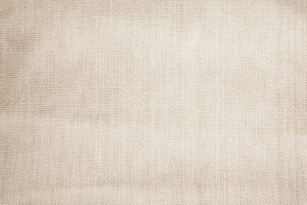 istock Brown sackcloth woven texture background in natural pattern. Jute hessian burlap, linen background in light beige cream color blank. Weaving canvas fiber line cotton cloth textured as organic. 2196840625