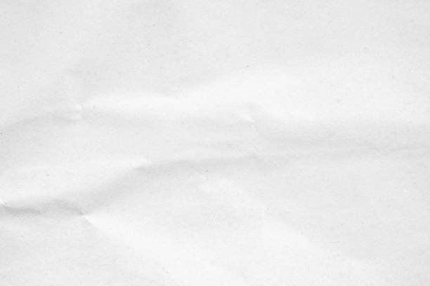 istock White recycled craft paper texture as background. Grey paper texture, Old vintage page or grunge vignette of old newspaper. Pattern rough art creased grunge letter. Hardboard with copy space for text. 2196840645