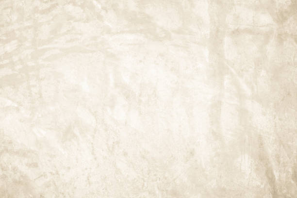 istock Dark old concrete wall texture background. Close Up retro plain cream color cement wall background texture. Design paper vintage parchment element show or advertise or promote product on display. 2196840766