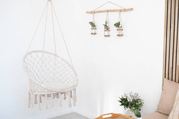 istock Hanging chair and decorative plants in a minimalist room 2196840961