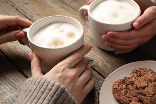 istock Women having coffee break at wooden table, closeup 2196841677