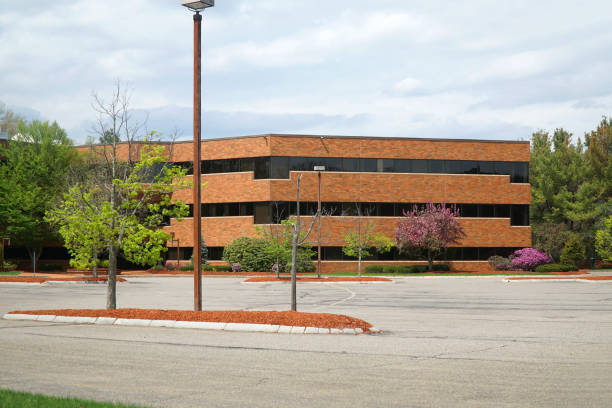 istock company buildings and empty parking lot 2196844395
