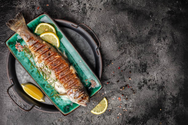 istock Grilled trout fish with lemon. banner, menu, recipe place for text, top view 2196844444