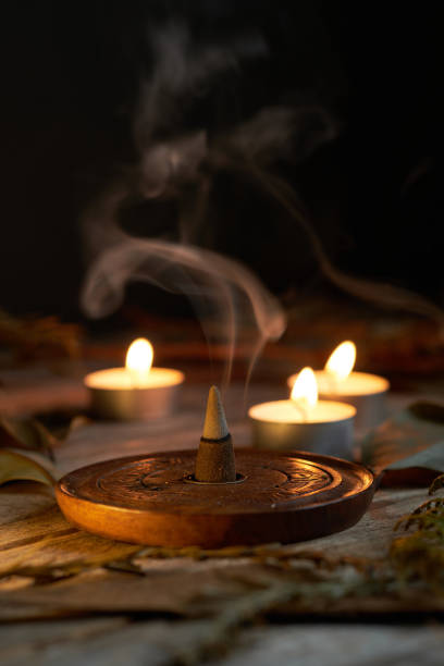istock Incense burning in dim light with candles creating a tranquil atmosphere 2196848675