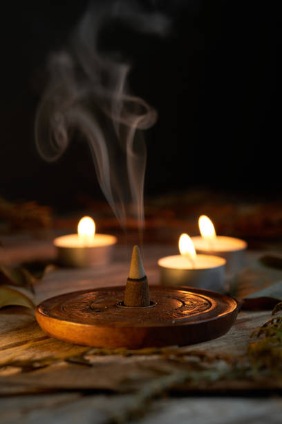 istock Incense burning in dim light with candles creating a tranquil atmosphere 2196848677