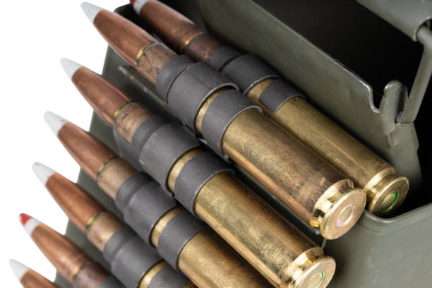 istock .50 BMG caliber machine gun ammunition belt with cartridges in ammunition can. 2196853458