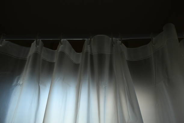 istock white plastic curtain texture in bathroom, scary scene 2196854135