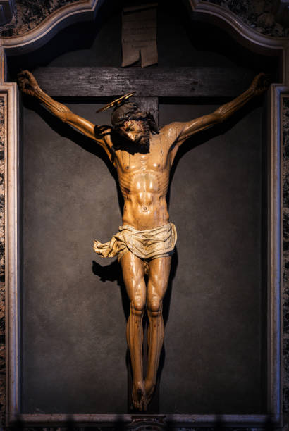 istock Wooden Crucifix of Christ in Dramatic Lighting 2196854287