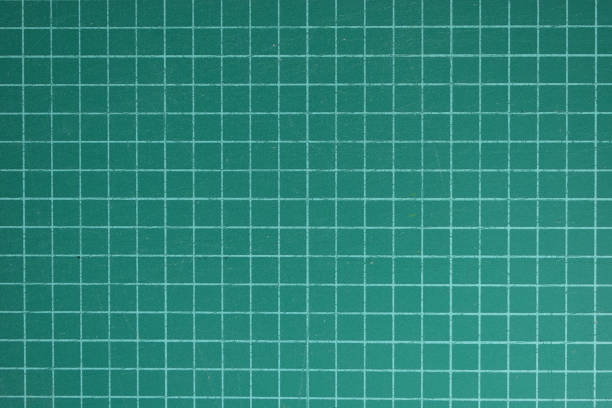 istock green cutting mat board background with line and scale measure guide pattern for object art design, tool equipment of diy craft work 2196855341