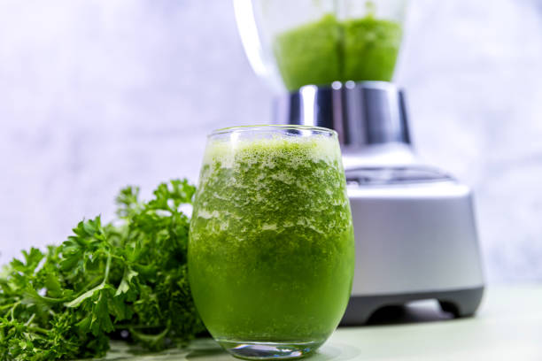 istock Fresh Green Juice in a Blender with Parsley Garnish 2196857772
