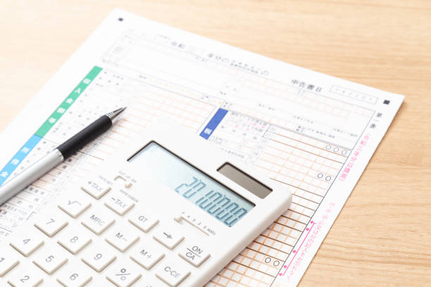 istock Tax return documents and a calculator on a desk. 2196858393