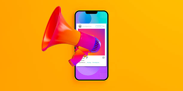 istock Social Media Smartphone Mockup with Megaphone on Yellow Background 2196863134