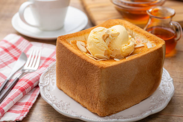 Honey Toast Topped with Vanilla Ice Cream and Sliced Almonds