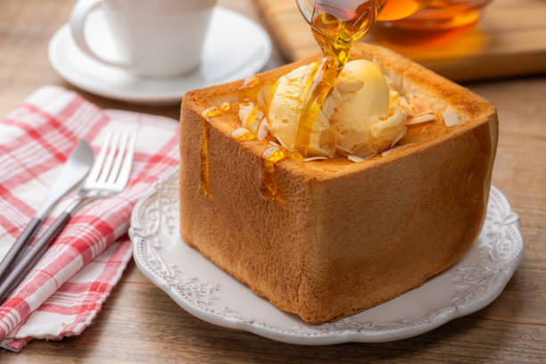 istock Pouring Honey Over Thick Honey Toast 2196867391