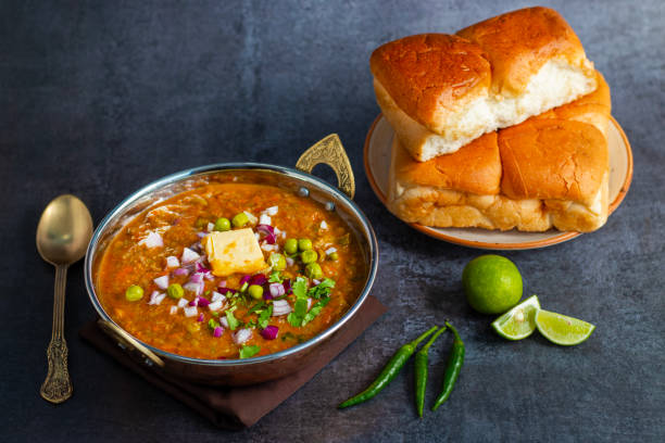 istock Pav Bhaji is a spicy, mashed vegetable curry served with buttered, toasted bread rolls, commonly enjoyed as a street food. 2196868507