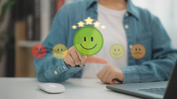 istock Customer service and Satisfaction concept, Business people touching the virtual screen on the happy Smile face icon to give satisfaction in service. rating very impressed. 2196869586