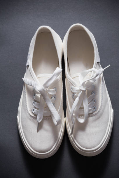 Convenient for sports mens sneakers on a grey background.