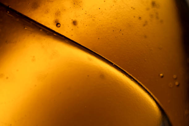 surface of oil or serum with bubbles. festive cosmetic background. Blurred background