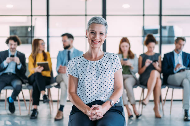 istock Confident businesswoman and her team. 2196870934