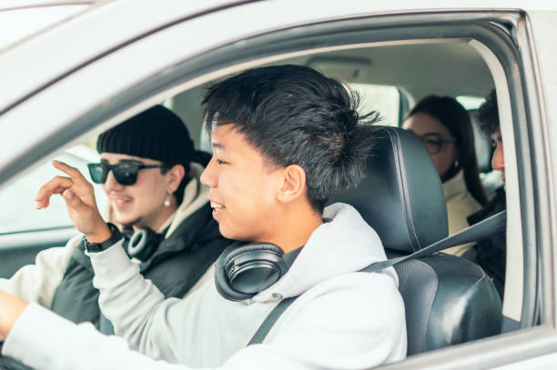 Diverse college friends sharing laughter and stories while carpooling, enjoying camaraderie and creating lasting memories during campus commute