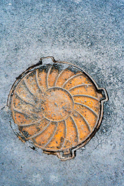 istock Weathered Manhole Cover with Geometric Design 2196872898