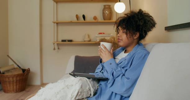istock A woman uses a tablet at home 2196873240