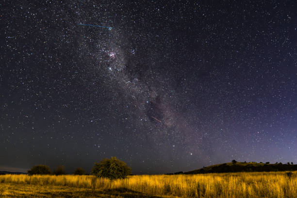istock The night sky and Milky Way Galaxy with satellites 2196873696