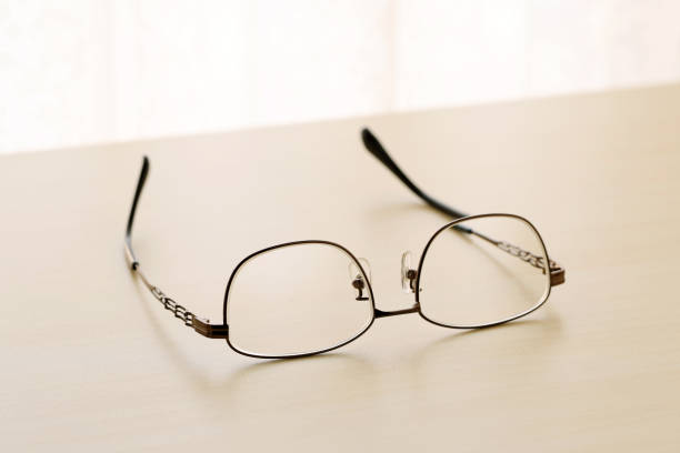 istock eye glasses on a wooden table 2196874127