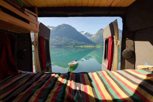 istock Camper van interior with view of turquoise lake in Norway 2196876439