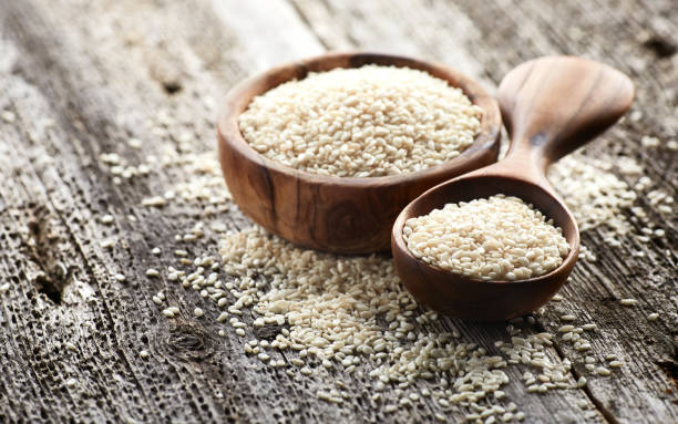 istock Sesame seeds on wooden board. 2196880641