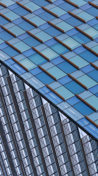 istock Modern Glass Architecture - Abstract Facade with Geometric Patterns and Reflections, Ideal for Real Estate Branding, Innovation Campaigns, or Urban Design Projects 2196884267