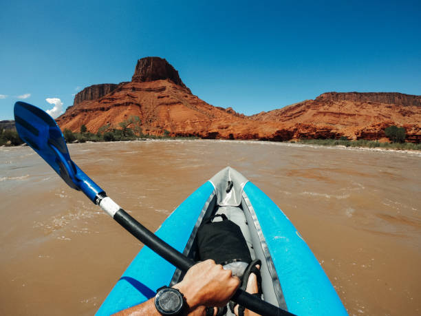 istock Man POV rafting rapids with kayak in Colorado river 2196890309