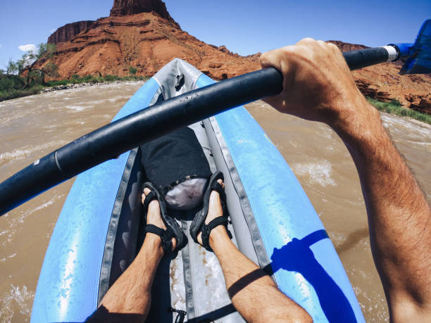 istock Man POV rafting rapids with kayak in Colorado river 2196890322
