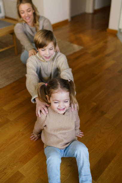 istock Children having fun playing whit their mother at home 2196896031
