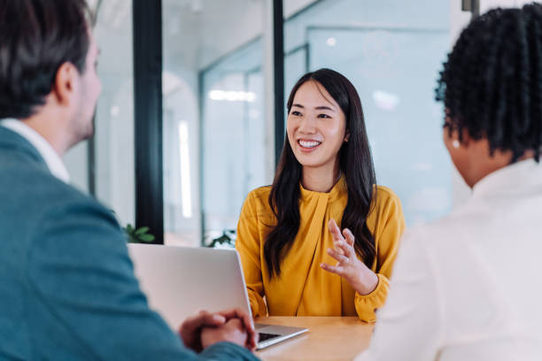 istock Group of business persons talking in the office. 2196896427
