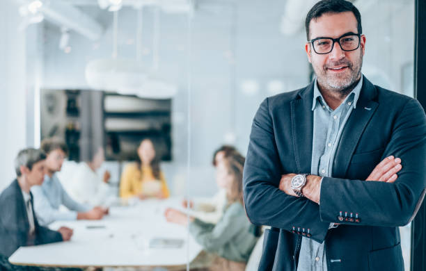 istock Confident businessman and his team. 2196896443