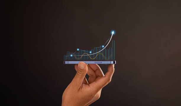 istock Mobile phone graph with percentage of business growth 2196897668